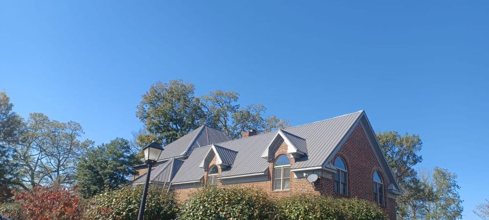 Brick home with completed metal roof