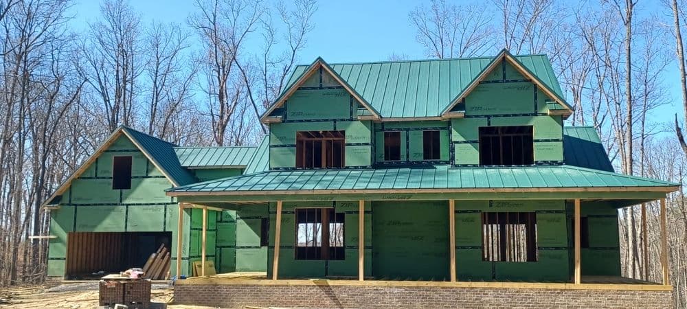 New home construction with framing and metal roof